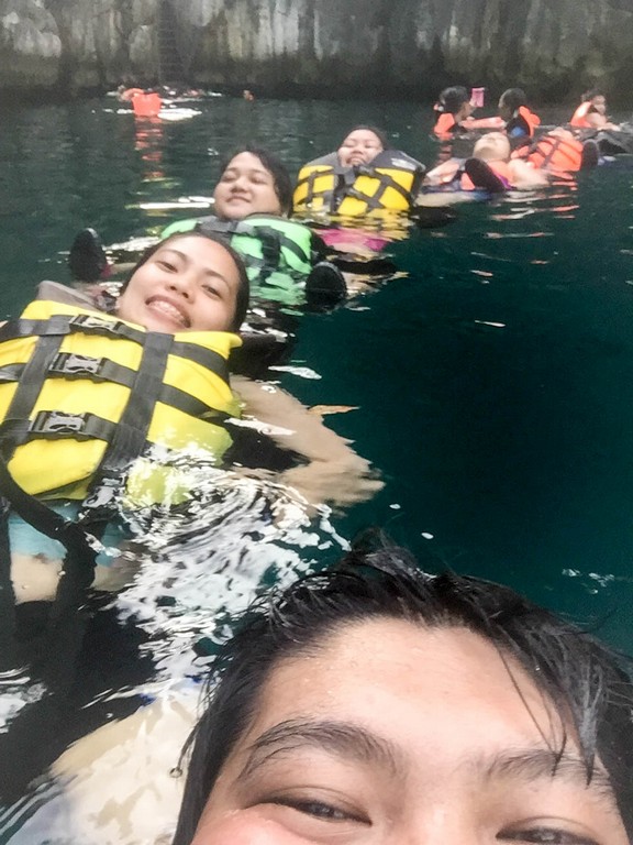 A fun activity in Coron island tour is lining up like a caterpillar in water