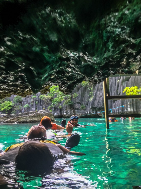 Nervous and excited to pass on this tunnel lying flat on our backs while having our Coron island tour