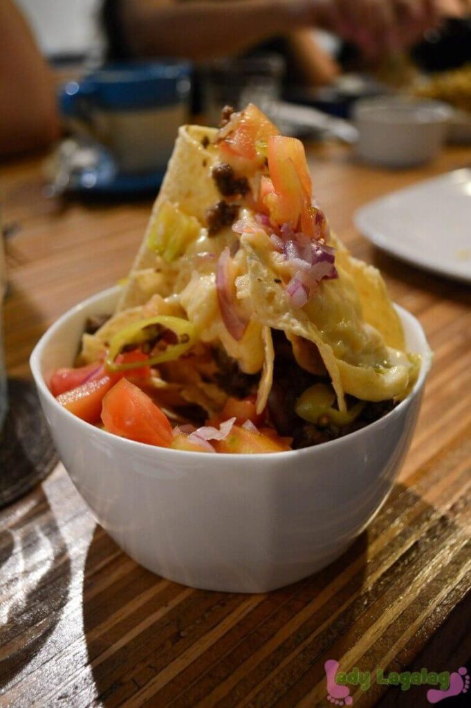 A towering dish of nachos from a restaurant in Poblacion