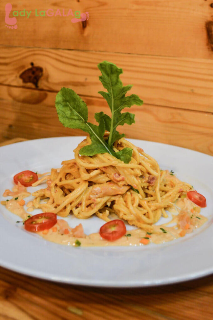 one of the pasta dishes you will love is this smoked salmon pasta at this restaurant in Molito