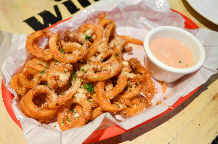 My favorite garlic parmesan curly twist fries at a restaurant in Makati